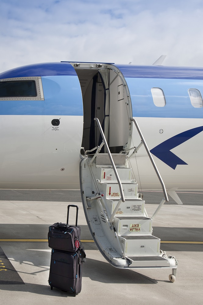 estonia,luggage near airplane steps